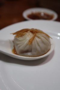 signature dish ziaolongbao at din tai fung served with ginger